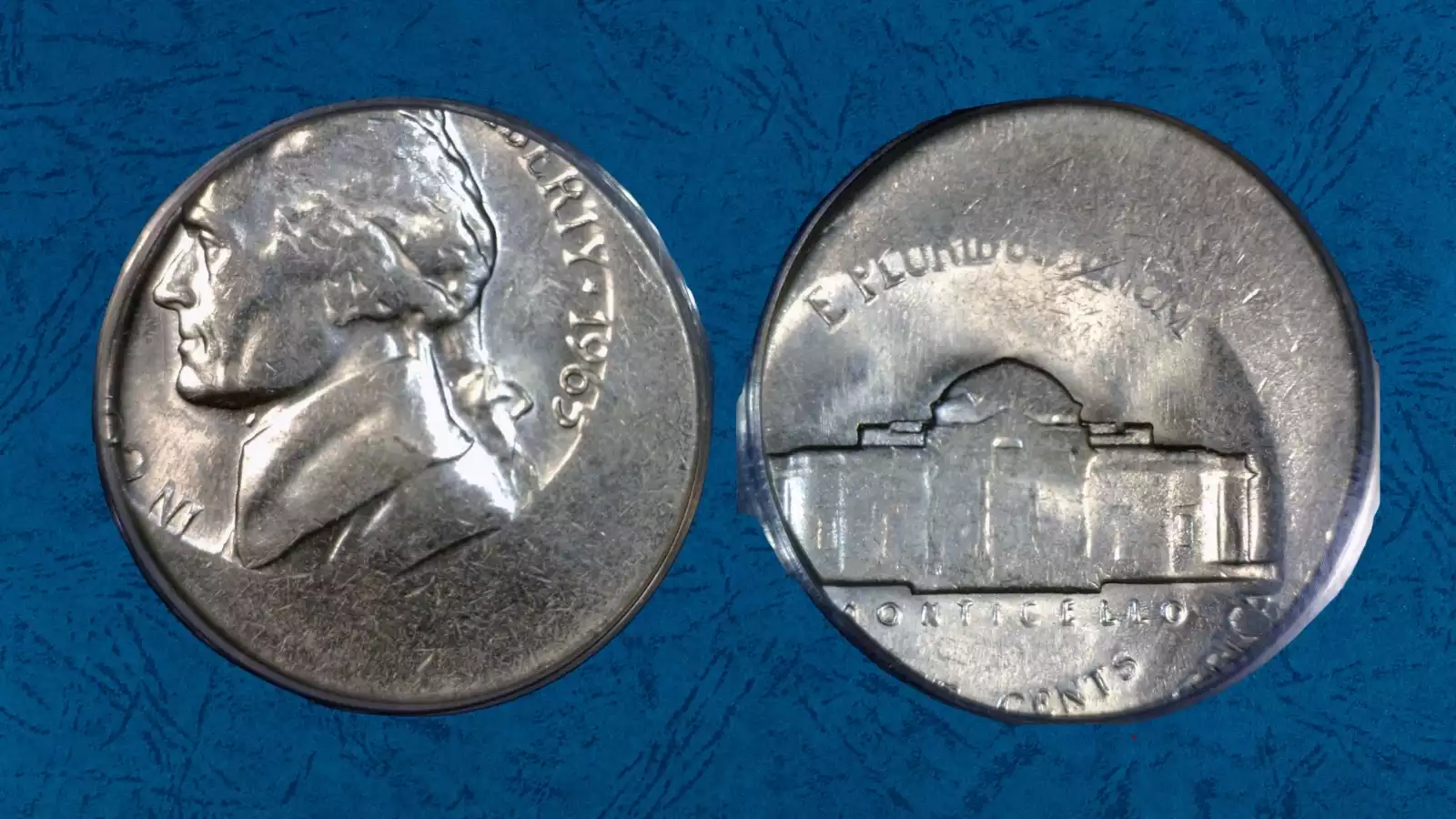 1965 Jefferson nickel off-center strike error — design shifted with blank crescent visible and date still readable